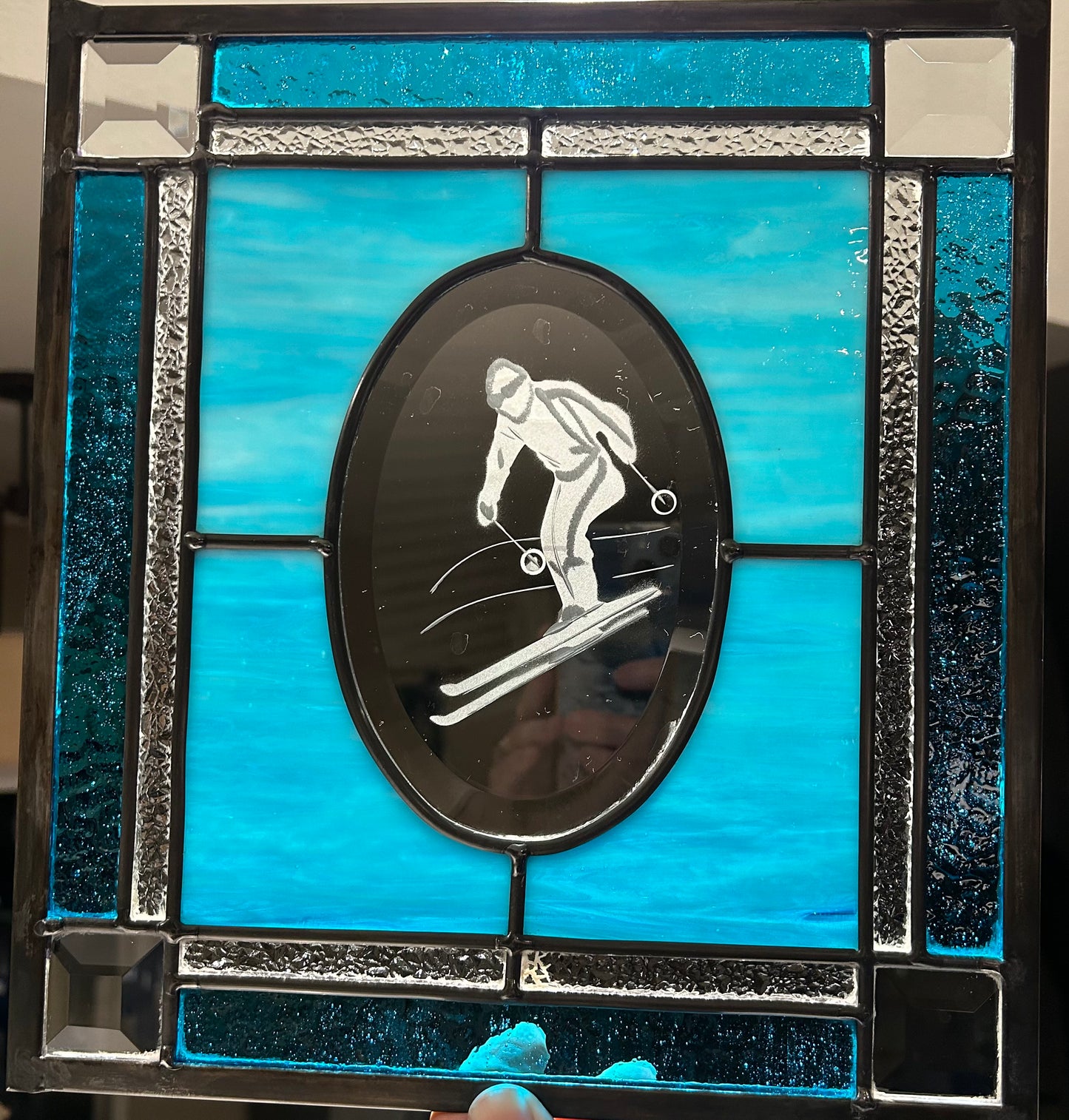 Blue beveled skier